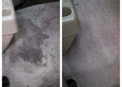 On the left, there's a stain by a cupholder. On the right, there is a cleaned fabric by a cupholder.
